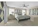 Comfortable bedroom with a large bed, neutral colors, and ample natural light at 6026 Jensen View Ave, Apollo Beach, FL 33572