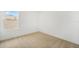 Bright bedroom with a window offering natural light, carpet flooring and neutral wall color at 6026 Jensen View Ave, Apollo Beach, FL 33572