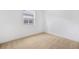Cozy bedroom with neutral carpet, white walls, and a bright window at 6026 Jensen View Ave, Apollo Beach, FL 33572