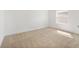Bedroom with neutral carpeting and a window providing natural light at 6026 Jensen View Ave, Apollo Beach, FL 33572