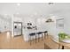 Modern kitchen featuring white cabinets, stainless steel appliances, and a center island with seating at 6026 Jensen View Ave, Apollo Beach, FL 33572