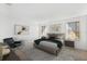 Stylishly furnished primary bedroom with natural light, modern decor and plush bedding at 6026 Jensen View Ave, Apollo Beach, FL 33572