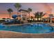 Beautiful community pool featuring a tower, a waterslide, and multiple spaces for people to gather and have fun at 6034 Jensen View Ave, Apollo Beach, FL 33572