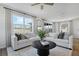 Bright, open living room featuring neutral décor, a modern round coffee table, and lots of natural light at 6034 Jensen View Ave, Apollo Beach, FL 33572