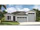 Charming single-Gathering home with a two-car garage, manicured lawn, and stone accents at 9120 Players Dr, Weeki Wachee, FL 34613