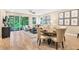 Inviting living room with sliding doors to patio, complemented by stylish decor and tile flooring at 9136 Players Dr, Weeki Wachee, FL 34613