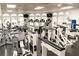 Fully equipped gym with treadmills, weight machines, and many windows for natural light at 9156 Players Dr, Weeki Wachee, FL 34613