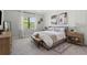 Bright bedroom with board and batten accent wall, neutral colors, modern decor and natural light at 14560 Eagle Branch Dr, Nokomis, FL 34275