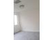 Bright bedroom with modern lighting and a large window for natural light at 7314 Patio Row, Hudson, FL 34667