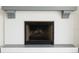 Close up of a white brick fireplace featuring gray accents at 7314 Patio Row, Hudson, FL 34667