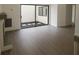 Bright living room boasts hardwood floors and sliding glass doors to a patio at 7314 Patio Row, Hudson, FL 34667