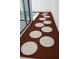 Stepping stones leading to a pool area, surrounded by mulch and modern architecture at 7314 Patio Row, Hudson, FL 34667
