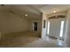 Welcoming foyer with tile flooring, window, and a view into the living area at 2305 De Vore St, North Port, FL 34291