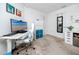 Office with sleek white desk, carpet, office chair, storage and a door to another room at 5424 Companion Ln, Tampa, FL 33619