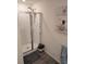 Modern shower with glass enclosure, updated fixtures, and a corner seat for added convenience at 5424 Companion Ln, Tampa, FL 33619
