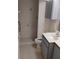 An updated bathroom with tiled shower, modern vanity, and neutral tones at 5905 Cleveland Dr, Punta Gorda, FL 33982