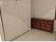 Bedroom with tan dresser, tiled floors and double closet at 5905 Cleveland Dr, Punta Gorda, FL 33982