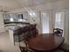 Bright dining area features an elegant chandelier and french doors with access to the outdoors at 5905 Cleveland Dr, Punta Gorda, FL 33982