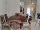 Formal dining room boasts an elegant chandelier and views to a bright foyer at 5905 Cleveland Dr, Punta Gorda, FL 33982