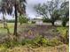 Sprawling rural lot with a home and detached garage, showing lots of potential at 5905 Cleveland Dr, Punta Gorda, FL 33982