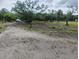 View of vacant lot with homesites available on a cloudy day at 5905 Cleveland Dr, Punta Gorda, FL 33982