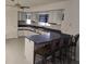 Bright kitchen features white cabinets, blue-gray countertops and modern design at 5905 Cleveland Dr, Punta Gorda, FL 33982