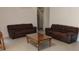 Spacious living room with tile floors, neutral paint, and large comfortable couches at 5905 Cleveland Dr, Punta Gorda, FL 33982
