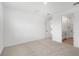 Neutral bedroom with carpet floors and ensuite bathroom with a double vanity at 6038 Jensen View Ave, Apollo Beach, FL 33572