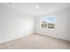 Bright bedroom with a large window offering natural light and a pleasant view at 6038 Jensen View Ave, Apollo Beach, FL 33572