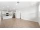 Bright, open living space featuring modern appliances, an island, and wood-look tile flooring at 6038 Jensen View Ave, Apollo Beach, FL 33572