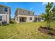 Large backyard featuring a well-maintained lawn and a view of neighboring homes at 6042 Jensen View Ave, Apollo Beach, FL 33572