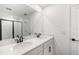 Stylish bathroom features a double sink, large mirror, and modern design elements at 6042 Jensen View Ave, Apollo Beach, FL 33572