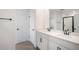 Bright bathroom features double sink vanity, quartz countertop, and modern fixtures at 6042 Jensen View Ave, Apollo Beach, FL 33572