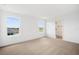 Bright bedroom with neutral carpet, large windows allowing natural light and views of the neighborhood at 6042 Jensen View Ave, Apollo Beach, FL 33572