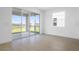Bright living room with tile floors and sliding glass doors that open to the backyard at 6046 Jensen View Ave, Apollo Beach, FL 33572