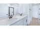 Elegant bathroom featuring double sinks, modern fixtures, and a glass-enclosed shower at 6058 Jensen View Ave, Apollo Beach, FL 33572