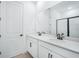 Contemporary bathroom with double vanity, sleek black fixtures, and a glass-enclosed shower at 6058 Jensen View Ave, Apollo Beach, FL 33572