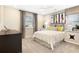 Cozy bedroom with a comfortable queen-sized bed, stylish decor, and bright natural light from the window at 6058 Jensen View Ave, Apollo Beach, FL 33572