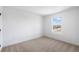 Bright bedroom with a window showcasing a view of the neighborhood at 6058 Jensen View Ave, Apollo Beach, FL 33572
