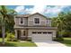 Charming two-story home with a two-car garage and inviting curb appeal at 6058 Jensen View Ave, Apollo Beach, FL 33572