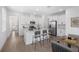 Bright and spacious kitchen with a center island, bar seating, white cabinetry, and stainless steel appliances at 6058 Jensen View Ave, Apollo Beach, FL 33572