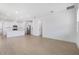Spacious living area featuring an open floor plan and modern stainless steel appliances at 6058 Jensen View Ave, Apollo Beach, FL 33572