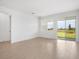 Bright living area with backyard views through sliding glass doors, filling the room with natural light at 6058 Jensen View Ave, Apollo Beach, FL 33572