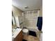 The bathroom features a shower over bath, vanity, and a toilet at 8728 Mallard Reserve Dr # 103, Tampa, FL 33614