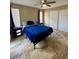 Bedroom boasts neutral walls, a ceiling fan, and double door closet at 8728 Mallard Reserve Dr # 103, Tampa, FL 33614