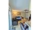 Bright living room with a sliding glass door, tile flooring, and neutral color scheme at 8728 Mallard Reserve Dr # 103, Tampa, FL 33614