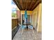Cozy patio with a table, chairs and an umbrella at 8728 Mallard Reserve Dr # 103, Tampa, FL 33614