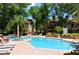 Inviting community pool surrounded by lounge chairs and lush landscaping, offering a resort-like experience at 8728 Mallard Reserve Dr # 103, Tampa, FL 33614