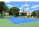 Well-maintained blue and green tennis court for recreational enjoyment and community engagement at 8728 Mallard Reserve Dr # 103, Tampa, FL 33614