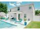 A stunning pool with plenty of space and patio area with furnishings for entertaining or enjoying the outdoors at 12236 Fairlawn Dr, Riverview, FL 33579